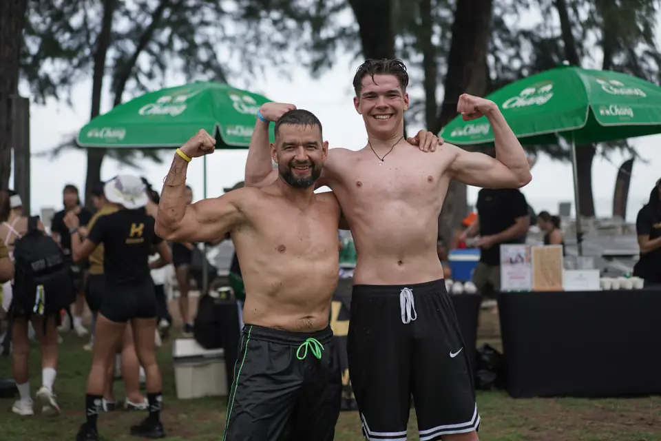 Two competitors flex side by side after the event