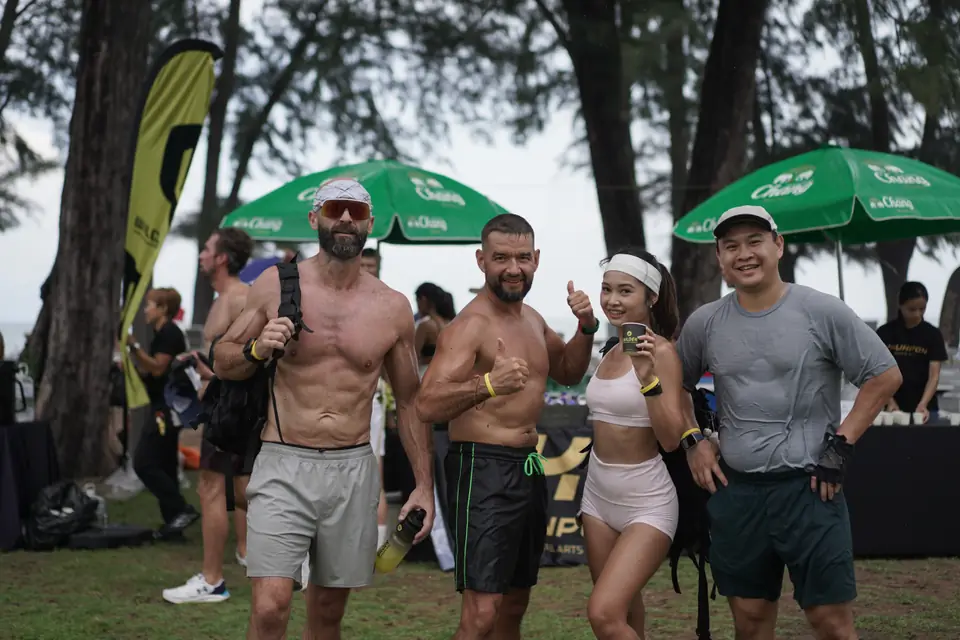 Four teammates give thumbs up after the final station