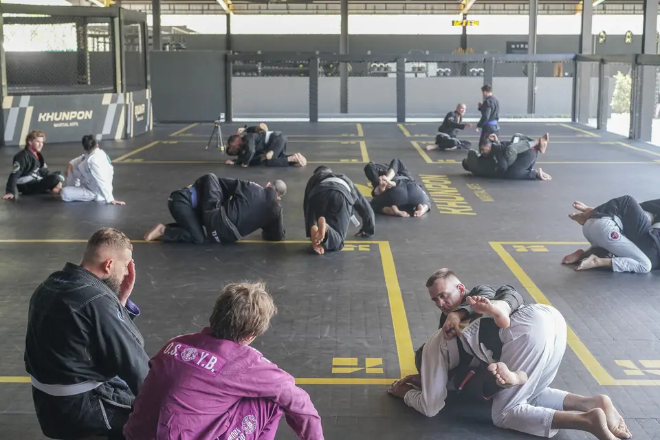The full mat area with pairs drilling and the cage in the background
