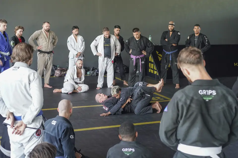 Practitioners in gis stand and watch a demonstration