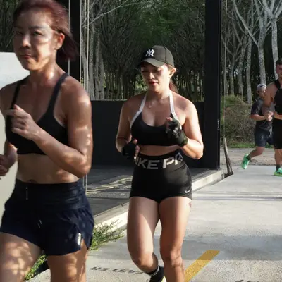 Members on a running interval outside the gym