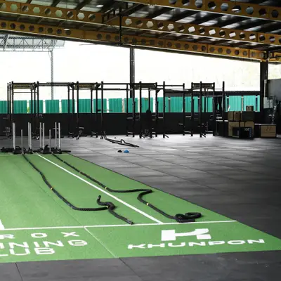 The HYROX Training Club turf strip and the free weights floor