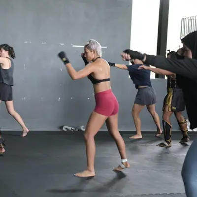 Shadow boxing in a Muay Thai group class