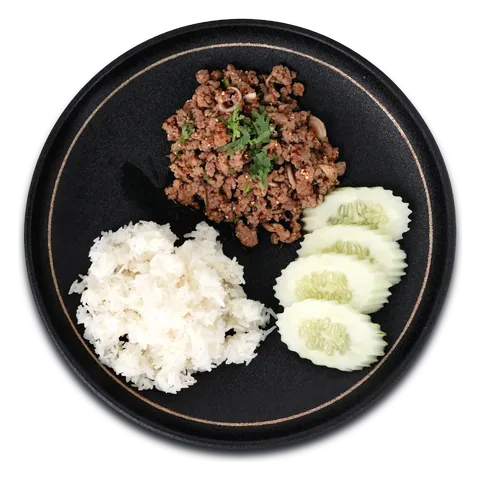 Larb with ground meat, steamed rice and cucumber on a black plate